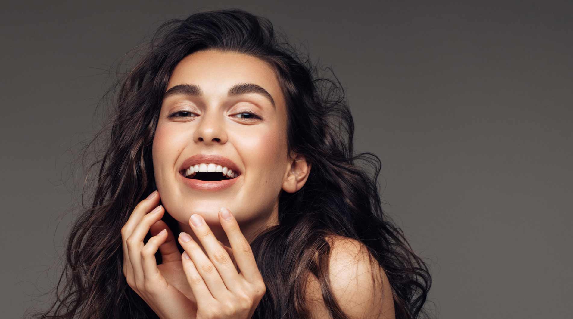 Woman with beautiful white porcelain veneers