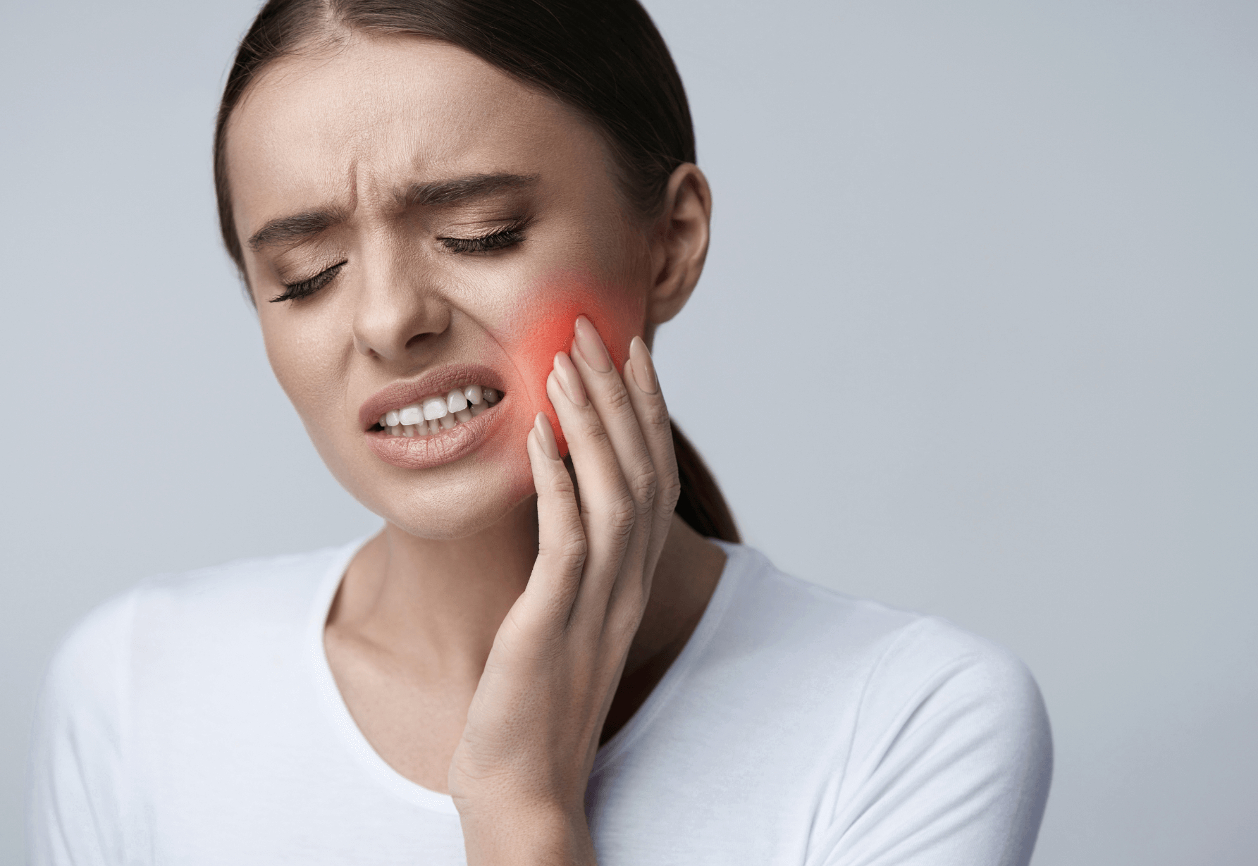 Woman in pain with a sore wisdom tooth